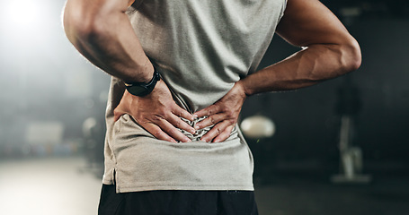 Image showing Fitness, back pain and hands of man at gym for training with muscle, problem or arthritis. Sports, injury and guy athlete with joint massage for backache, fibromyalgia or osteoporosis accident