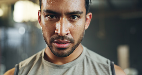 Image showing Man, sweating face and breathing in gym for fitness challenge, exercise endurance or break. Serious portrait, strong asian bodybuilder and tired for training, workout fatigue and breathe for recovery