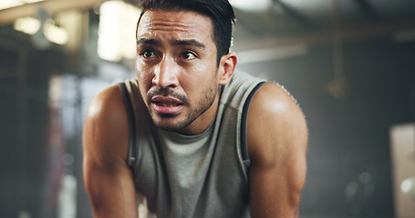 Image showing Sweat, fitness and man tired from gym, workout or rest in training in cardio, sports and body builder breathing with fatigue. Exhausted, break and athlete with commitment for health challenge