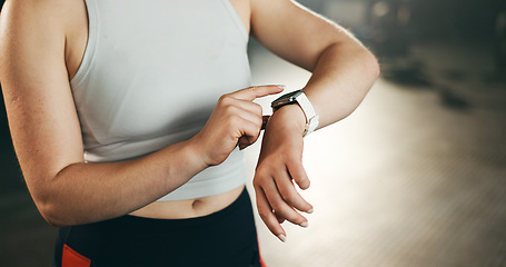 Image showing Smart watch, hands and woman in gym for fitness, exercise results and workout performance. Stopwatch, closeup and check information, timer and monitor healthy training progress, clock and sports gear