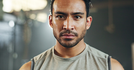 Image showing Man, sweating face and breathing in gym for fitness challenge, exercise endurance or break. Serious portrait, strong asian bodybuilder and tired for training, workout fatigue and breathe for recovery