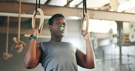 Image showing Sports, gymnastics and black man doing pull up exercise for arm muscle training or workout in gym. Fitness, bodybuilding and African male athlete doing an intense strength challenge in health center.