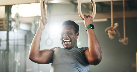 Image showing Gym, intense gymnastics and black man doing pull up exercise, arm muscle building or bodybuilding for strength training. Determined, athlete and African person doing fitness, challenge or workout