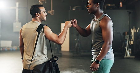 Image showing Teamwork, friends and fist bump with people in gym for motivation, support and workout. Personal trainer, health and exercise with men in fitness center for training, wellness or performance together