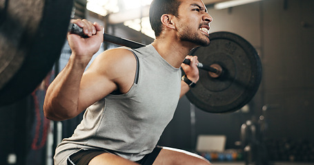 Image showing Man at gym, weight lifting and barbell with focus on muscle building endurance, strong body and balance power in fitness. Commitment, motivation and bodybuilder in workout for health and wellness.