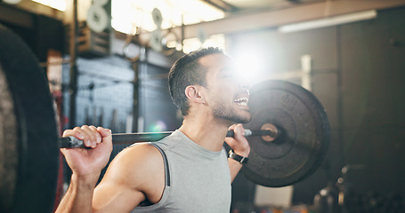 Image showing Man at gym, weight lifting and barbell with focus on muscle building endurance, strong body and balance power in fitness. Commitment, motivation and bodybuilder in workout for health and wellness.