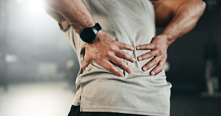 Image showing Fitness, back pain and hands of man at gym for training with muscle, problem or arthritis. Sports, injury and guy athlete with joint massage for backache, fibromyalgia or osteoporosis accident