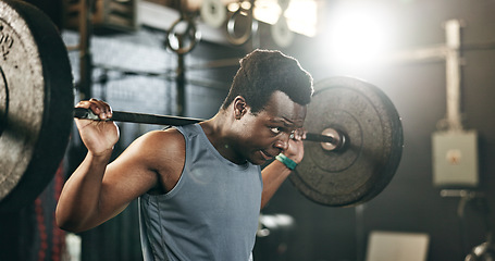 Image showing Black man at gym, weight lifting and barbell for muscle building endurance, strong body or balance power in fitness. Commitment, motivation and bodybuilder in workout challenge in health and wellness