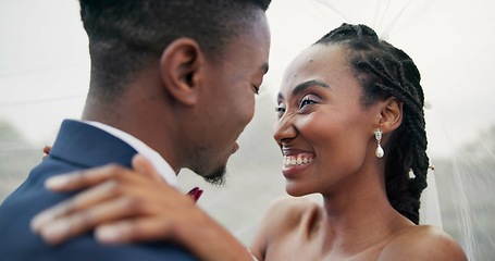 Image showing Outdoor, kiss and black couple with marriage, wedding and hug with happiness, romance and celebration. African man, happy woman and embrace outside, love and bride with groom, romantic and commitment