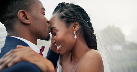 Image showing Outdoor, kiss and black couple with love, wedding and hug with marriage, happiness and celebration. African man, happy woman and embrace outside, event and bride with groom, romance and countryside