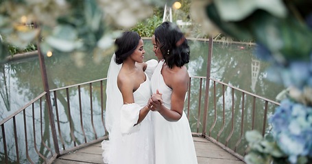 Image showing Wedding, lesbian and women dancing outdoor together at ceremony for celebration, happiness and romance. Marriage, love and lgbtq people holding hands and moving with smile in elegant dress in nature