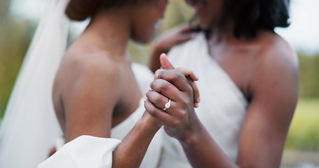 Image showing Wedding, lesbian and women dancing outdoor together at ceremony for celebration, happiness and romance. Marriage, love and lgbtq people holding hands and moving with smile in elegant dress in nature