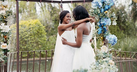 Image showing Wedding, lesbian and women dancing outdoor together at ceremony for celebration, happiness and romance. Marriage, love and lgbtq people embracing and moving with smile in elegant dress in nature