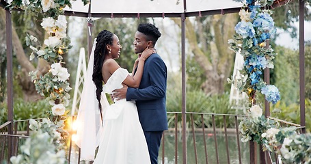 Image showing Wedding, dance and black couple in garden with love, celebration and excited future together. Gazebo, man and woman at luxury marriage reception with flowers, music and happiness at party in nature.