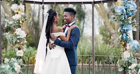 Image showing Wedding, first dance and black couple in garden with love, celebration and excited for future together. Gazebo, man and woman at marriage reception with flowers, music and happiness at outdoor party.