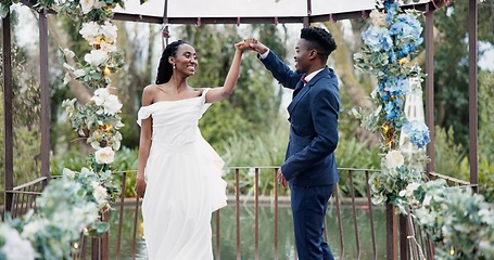 Image showing Wedding, first dance and black couple in garden with love, celebration and excited for future together. Gazebo, man and woman at marriage reception with flowers, music and happiness at outdoor party.