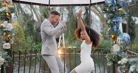 Image showing Dance, happy and a couple at a wedding with love, bonding and fun in marriage. Smile, excited and a young man and woman with celebration, moving and energy together after commitment in relationship