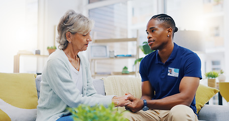Image showing Black man, caregiver or old woman holding hands for support or empathy in cancer rehabilitation. Medical healthcare advice, senior person or male nurse nursing, talking or helping elderly patient