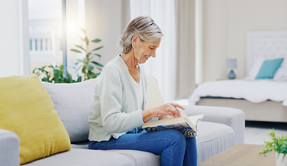 Image showing Senior woman, book and reading to relax in living room for story, novel and knowledge. Elderly female person, books and focus in lounge for retirement break, literature and hobby on sofa at home