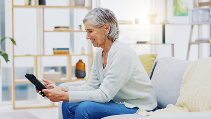 Image showing Relax, tablet and senior woman on sofa in living room scroll on social media, mobile app or the internet. Rest, online and elderly female person browsing on website with technology in lounge at home.