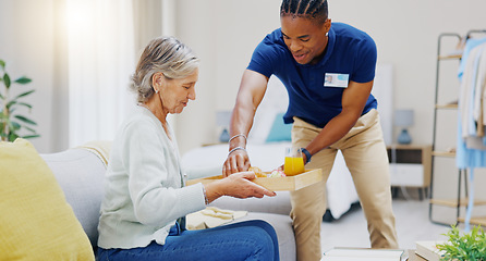 Image showing Breakfast, assisted living and retirement with a old woman on a sofa in the living room of her home. Morning, food and a nurse black man serving a meal to an elderly patient in a care facility