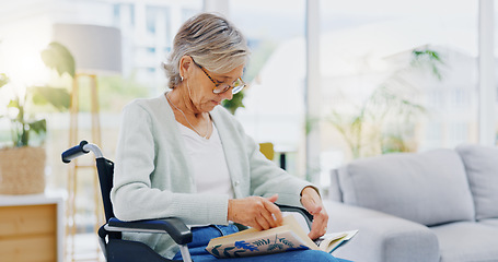 Image showing Senior woman, book and reading to relax in living room for story, novel and knowledge. Elderly female in wheelchair, enjoying books and focus in lounge for retirement break, literature and hobby at r