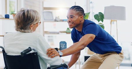 Image showing Black man, caregiver speaking or old woman in wheelchair talking or supporting in homecare rehabilitation. Medical healthcare or happy male nurse nursing or helping elderly patient with disability