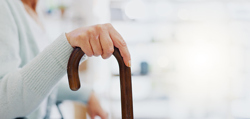 Image showing Hand, walking stick and closeup for woman in living room, nursing home or hospital for mobility support. Cane, crutch or rehabilitation for disability, stroke or injury for elderly lady with problem