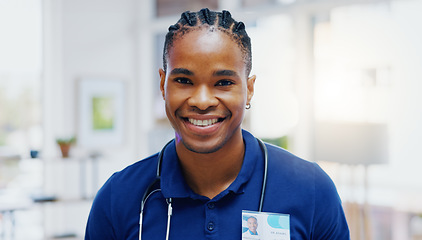 Image showing Black man, doctor and smile on face in clinic for healthcare services, excited or happy for job. African medic, male nurse and happiness in portrait for wellness service, medical career or workplace