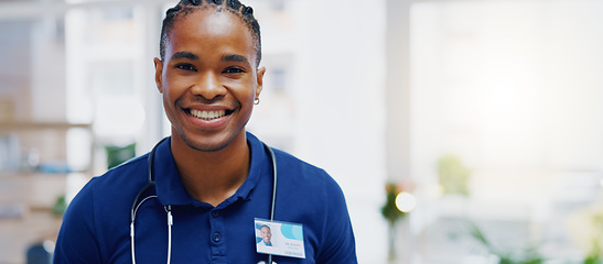 Image showing Black man, doctor and smile on face in clinic for healthcare services, excited or happy for job. African medic, male nurse and happiness in portrait for wellness service, medical career or workplace