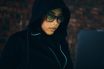 Image showing Hacker, woman in dark room with laptop and information technology, coding and database, phishing with cyber crime. Cybersecurity, programming or hacking, criminal with pc for ransomware and firewall