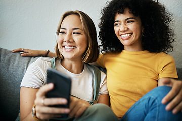 Image showing Love, smile and a lesbian couple watching tv on a sofa in the living room of their home together. Relax, LGBT and a woman with her girlfriend enjoying a movie on a subscription streaming service