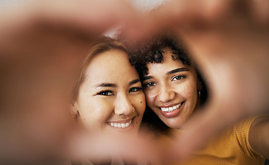 Image showing Lesbian couple, smile and heart with hands, portrait and closeup for romance, bonding and love and support for relationship. Happy people, together and solidarity for pride, lgbtq and hope for peace