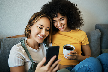 Image showing Lgbtq, sofa and couple relax with phone and coffee for social media, internet and watching videos. Love, home and happy women in living room for bonding, relationship and streaming movies online