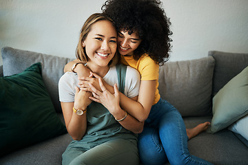 Image showing Lgbt, couple and portrait of hug on sofa in home, living room or apartment with love, support and happiness. Lesbian, women and embrace together with smile on face on lounge couch in new house