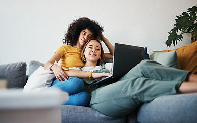 Image showing Lgbtq, laptop and couple relax on sofa for watching movies, streaming series and online videos. Dating, lesbian and happy women on computer for internet, bonding and relationship in living room