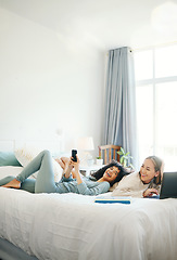 Image showing Technology, social media and morning with a lesbian couple in bed together in their home on the weekend. Relax, diversity and an lgbt woman with her girlfriend in the bedroom for love or bonding