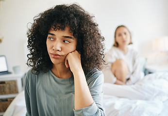 Image showing Lgbtq, woman and frustrated for couple fight in bedroom of home with conflict, crisis or problem in relationship. Lesbian, partner and girl on bed with stress, anxiety and depressed for argument