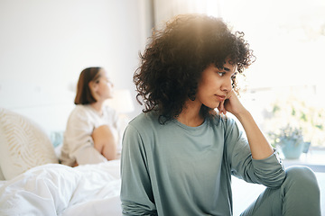 Image showing Lgbtq, woman and stress for couple fight in bedroom of home with conflict, crisis or problem in relationship. Lesbian, partner and girl on bed with sad, anxiety and depressed for argument and divorce