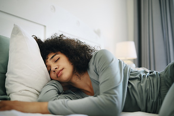 Image showing Woman, Tired and sleeping on bed in bedroom with fatigue and burnout, dream and relax for stress relief. Exhausted, person and girl in house or home lying on pillow in apartment for wellness and calm