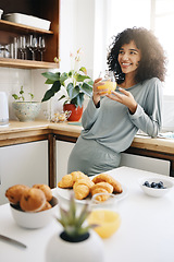 Image showing Woman, smile and thinking with orange juice in kitchen for breakfast, nutrition and vitamin c in the morning. Food, person and happiness with idea and drink with pajamas or natural face for wellness