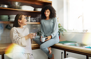 Image showing Coffee, smile and lesbian couple in home kitchen, bonding and communication. Drink tea, gay women and happy girls in the morning at breakfast together in interracial relationship, care and LGBT love