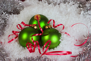 Image showing Green Xmas Ornaments with snow and garland