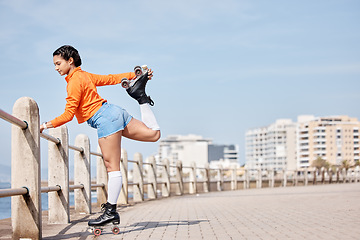 Image showing Roller skate, stretching and mockup with a girl at the promenade on a blue sky background for the weekend. Fitness, beach and balance with a young person skating outdoor during summer on banner space
