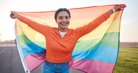 Image showing Woman, portrait and rainbow pride flag with smile outdoor for peace, equality and community support. Queer lgbtq person, sexuality and human rights to respect freedom happiness, identity or inclusion