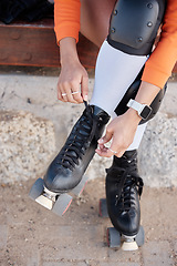 Image showing Roller skate, shoes and hands of woman outdoor with exercise, workout or training with wheels on sidewalk or ground. Fun, sport and start fitness with cardio, rollerskating and safety gear in summer