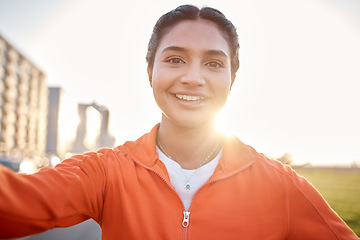 Image showing Woman, selfie and smile in city park, sunshine and outdoor for adventure, web blog and portrait in nature. Influencer girl, photography and profile picture for memory, social media and live streaming