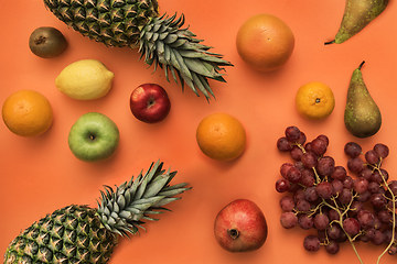 Image showing Different fruits on bright color background.