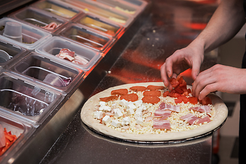 Image showing making pizza at kitchen of pizzeria