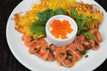 Image showing potato pancakes salmon fish and red caviar